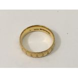 A 22ct gold wedding band.Approx 4.5g, L