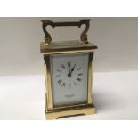 A brass cased carriage clock Searle &Co Ltd.