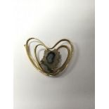 A continental contemporary gold Double heart brooch .