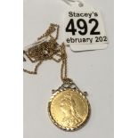 A 9ct gold mounted 1889 sovereign with a 9ct gold chain