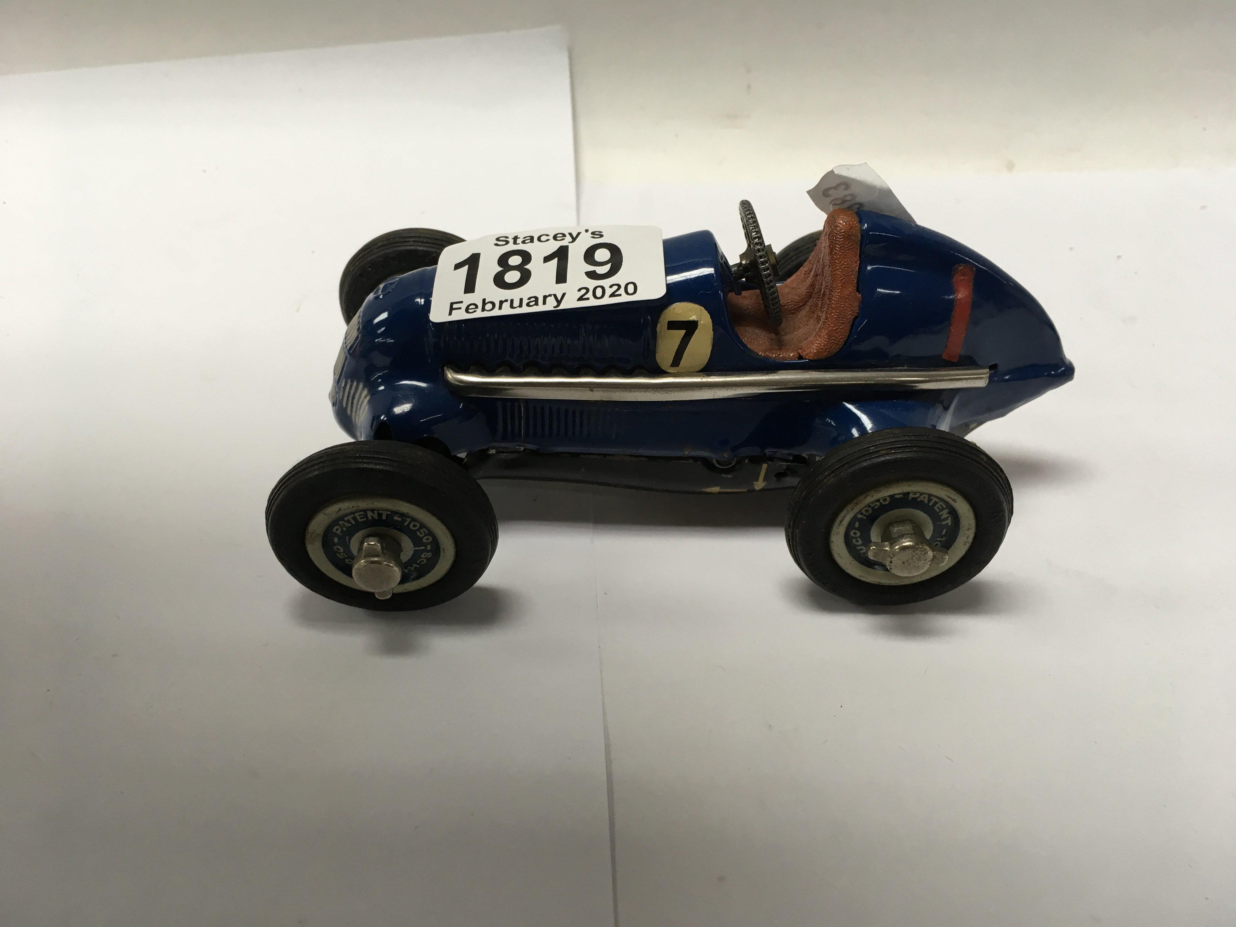 A vintage studio 1050 clockwork schuco racing car