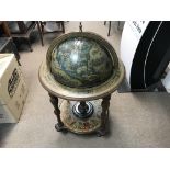 A free standing illustrated astrology globe of the
