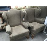 A traditional design three piece suite comprising a pair of wing arm chairs with ball and claw