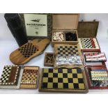 A collection of various chess sets, dominos etc.