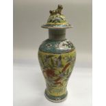 A late 18th / early 19th Century famille juane vase and cover, approx 28.5cm.