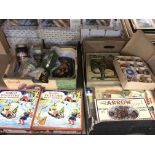A collection of vintage advertising tins and signs plus old jigsaw puzzles and Christmas baubles.