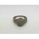 A 9ct gold diamond cluster ring, approx 4.4g and approx size O.