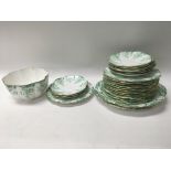 A collection of foley tea ware including cups plates and side plates decorated with flowers and