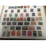 A collection of albums containing world stamps