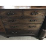 A Georgian mahogany chest of drawers the rectangular top above two short and three long drawers on