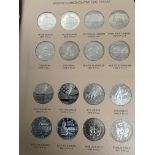 An Album containing silver proof and Uncirculated Modern Commemorative half dollars from 1982-2017