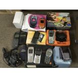 A box of vintage mobile phones, mostly in original boxes.