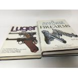 A collection of books An illustrated history of the Luger illustrated Encyclopaedia of Firearms