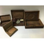 A group of boxes to include a brass inlaid box and Indian carved box. Also includes a small group of