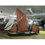 A wooden built model of a Thames barge, approx length 84cm.