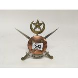 A brass copper and steel emblem post 1897 Touchi Scoutts. 15cm