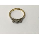 A 18 ct gold ring inset with diamonds .