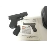 A deactivated Glock 19 semi-auto 9mm close protection pistol with handbook and case serial number