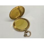 A large, 9ct gold locket with photo frame.Approx 20g