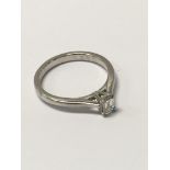 A platinum diamond solitaire ring, with square cut stone approx .33ct.Approx N