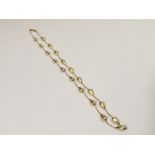 A 14k gold necklace with smooth and textured pear