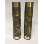 A pair of l world war brass shell cases reposse chased with foliage and hammered decoration.hight