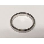 A platinum wedding band with personal inscription. Weight 4.7g approx. Ring size I.