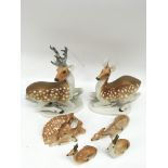 A group of Russian Lomonosov porcelain deer models.Largest 30cm high, damage to one small example
