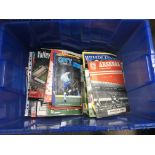 A box containing a large collection Of football season programmes and annuals including Spurs,