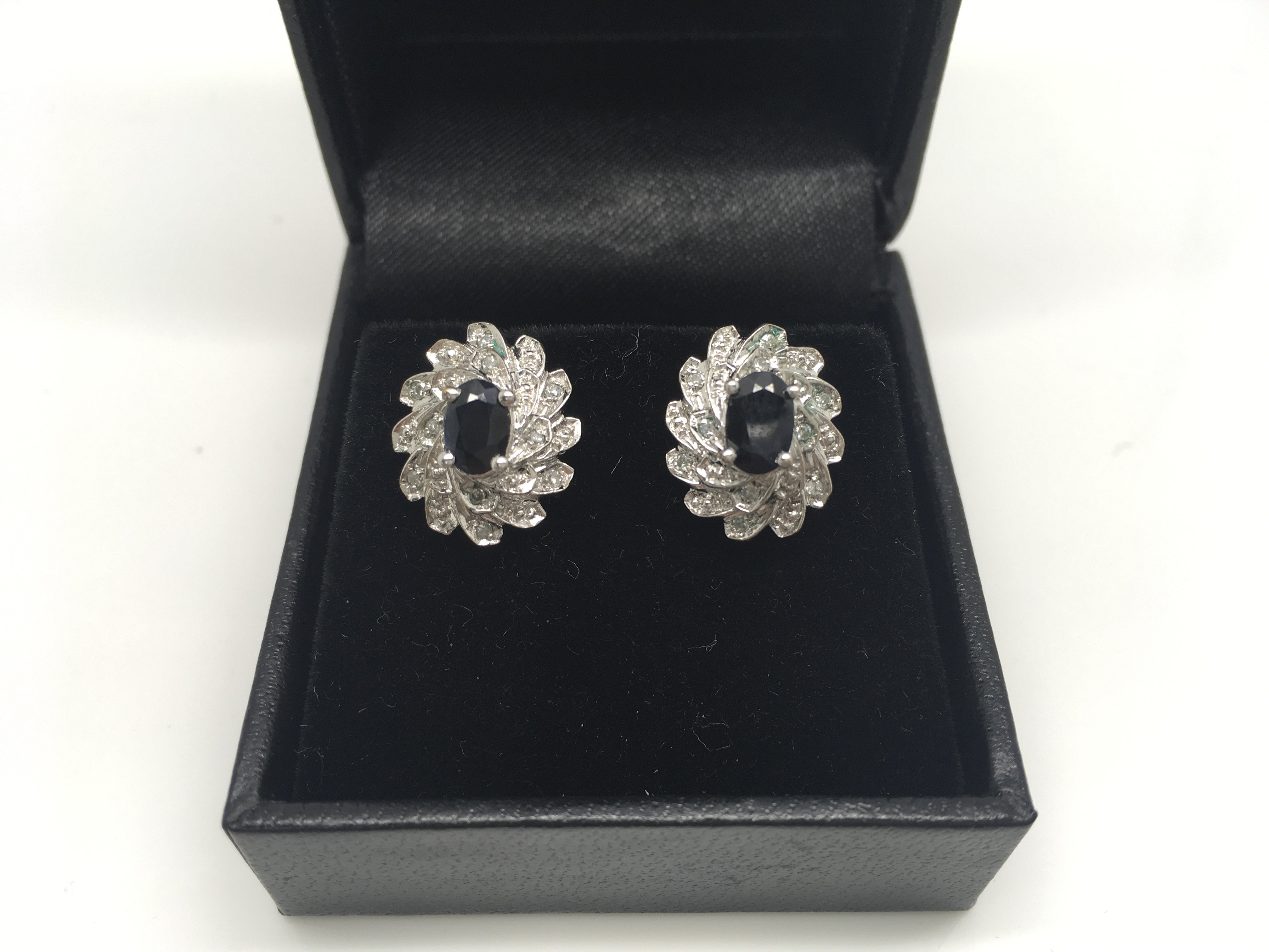 A pair of 9ct white gold and sapphire earrings, we