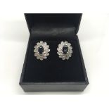A pair of 9ct white gold and sapphire earrings, we