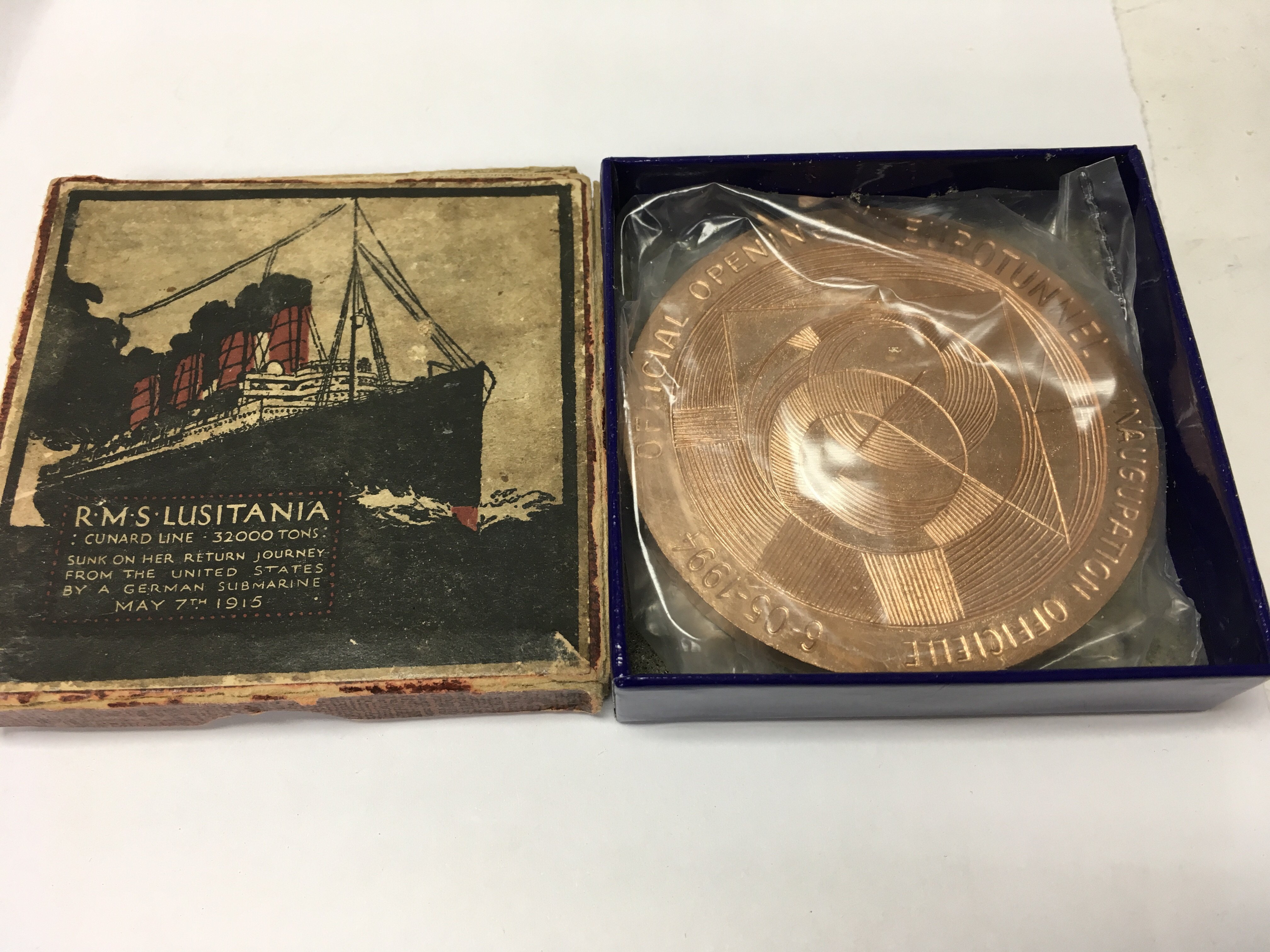 A box Lusitania medallion and a Euro Star medallion.