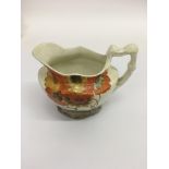 A Clarice Cliff 'Rhodanthe' pattern jug.Approx 11cm, some discolouration to underside of base.
