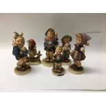 A collection of Goebel figures