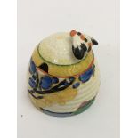 A Clarice Cliff, small 'Fantasque, Secrets pattern' honey pot of ribbed form.Approx 8cm, some