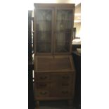 A light wood bureau bookcase.Approx 73x20x193cm high