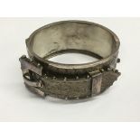 A Victorian engraved silver buckle bangle.Approx 47g