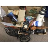 Two boxes of oddments comprising two iron models of bicycles, various tins, a pair of scales etc.