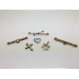 A group of six diamond set items comprising three stick brooches and three pendants, approx total