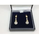 A pair of good quality Art Deco 9ct yellow and white gold earrings set with diamonds, approx 4.3g.