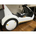 A Sinclair C5 with keys and paper work.