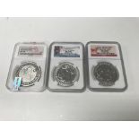 A group of three silver 1oz coins,