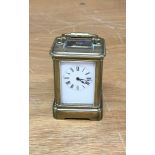 A miniature 4 glass brass carriage clock