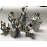 A collection of six lladro figures