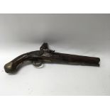 An antique flintlock pistol bearing marks including “22 LD” on the trigger guard.