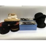 A collection of hats and shoes comprising a top hat, bowler hat, beret etc.