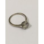 An unmarked white gold, diamond solitaire ring, included stone, approx 1.1/4gt, O.