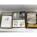 A collection of stamps in albums and other letter covers plus a box of postcards.