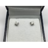 A pair of 18ct white gold diamond studs, boxed. Diamonds 0.30ct