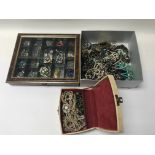 A group of costume jewellery including brooches, n